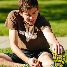 St. Bonaventure University student doing stretching exercises